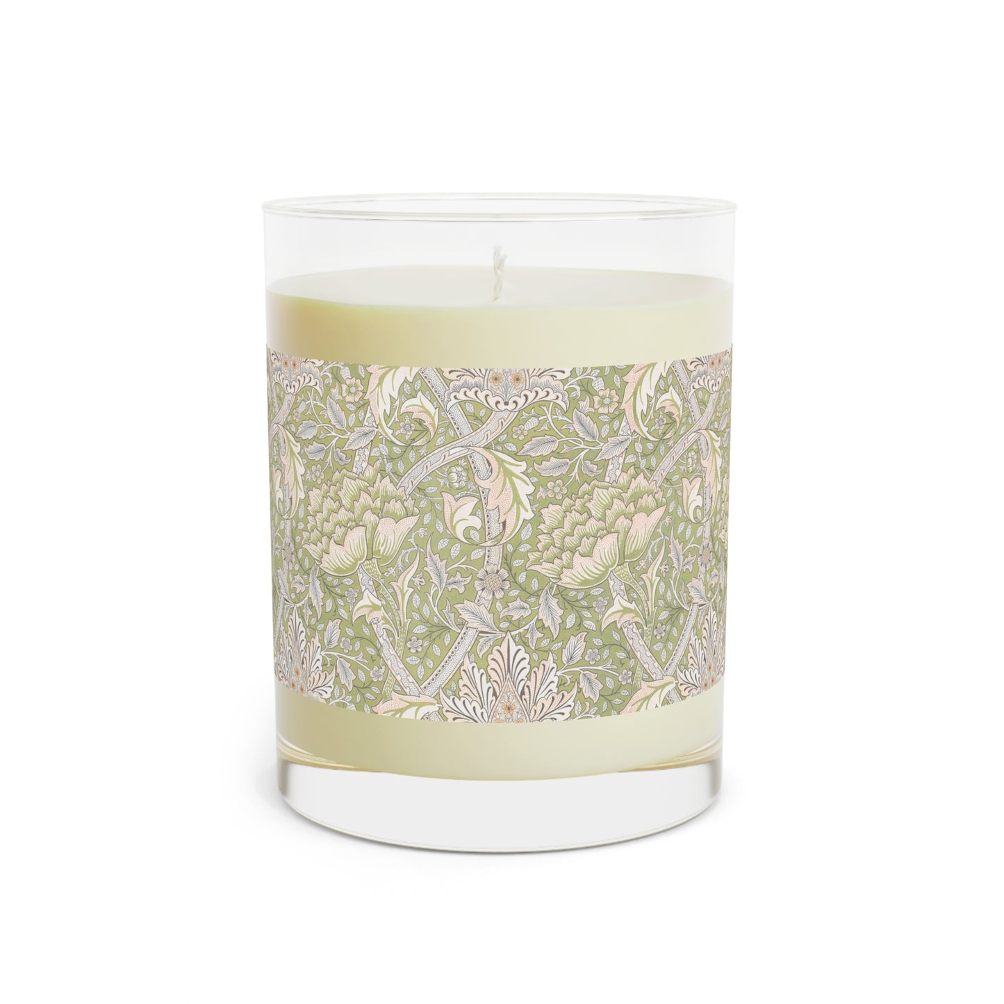 A luxury scented candle with a green and brown William Morris & Co floral patterned wrap around it, labeled 'Brook' from the Windrush Collection. The candle is in a clear jar with a brown cardboard lid.