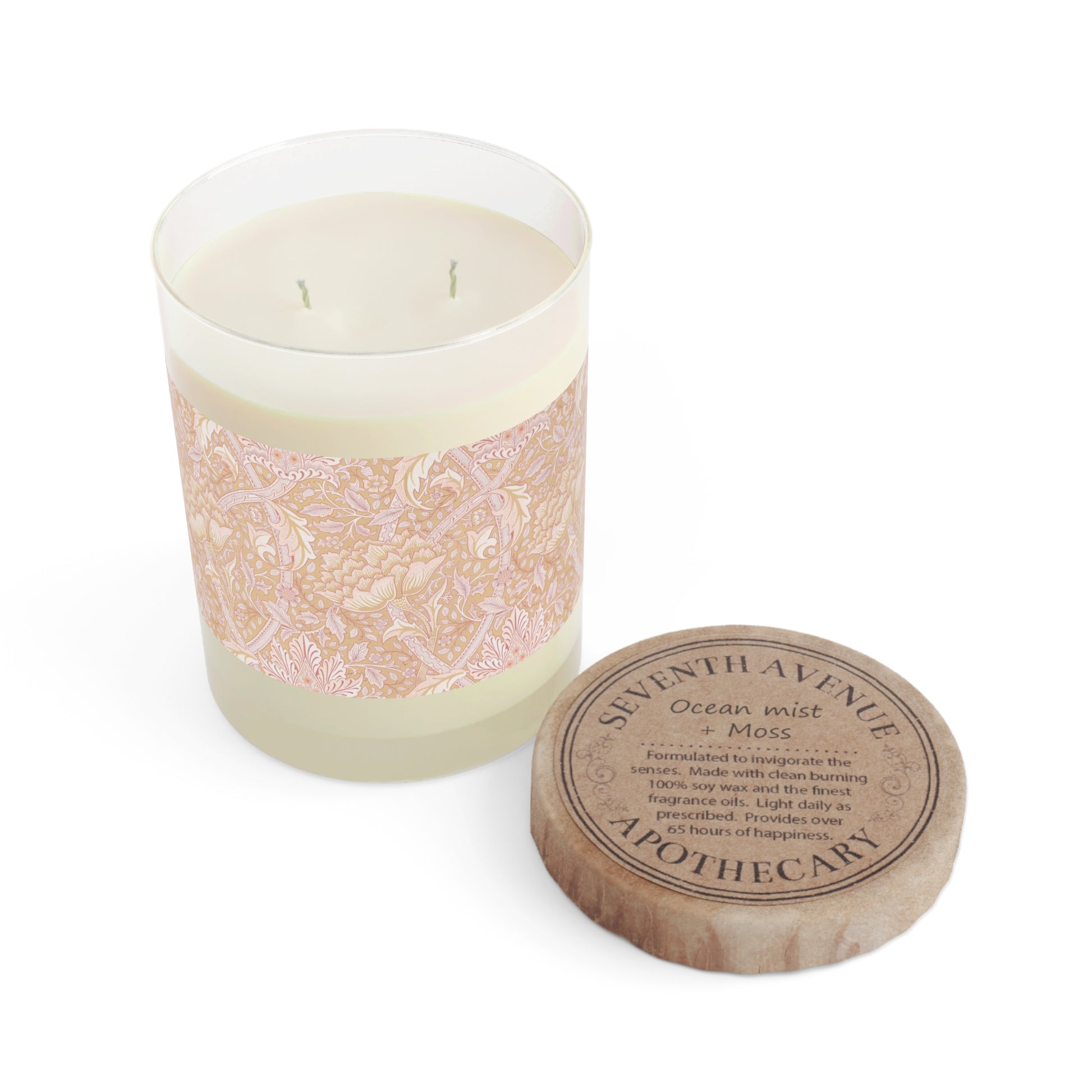 A luxury scented candle with a floral William Morris & Co pattern wrap around the glass jar, alongside a brown cardboard lid.