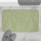 A rectangular green microfibre bath mat with a floral pattern inspired by William Morris - Acorns & Oak Leaves Collection.