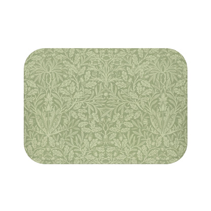 A rectangular green microfibre bath mat with a floral pattern inspired by William Morris - Acorns & Oak Leaves Collection.
