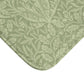 A rectangular green microfibre bath mat with a floral pattern inspired by William Morris - Acorns & Oak Leaves Collection.
