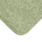 A rectangular green microfibre bath mat with a floral pattern inspired by William Morris - Acorns & Oak Leaves Collection.