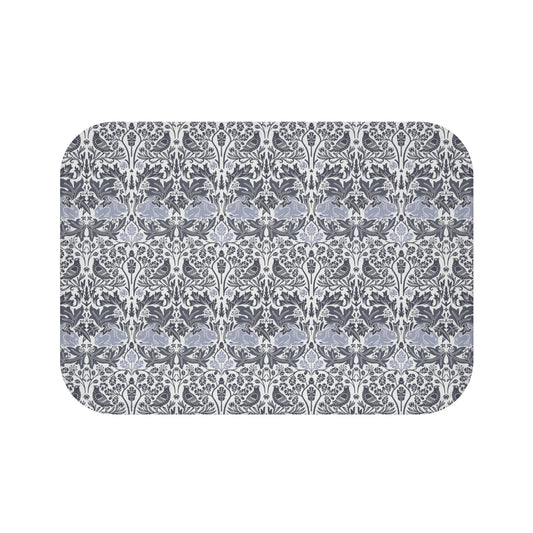 Microfibre bath mat with a gray and white floral pattern inspired by William Morris' work.