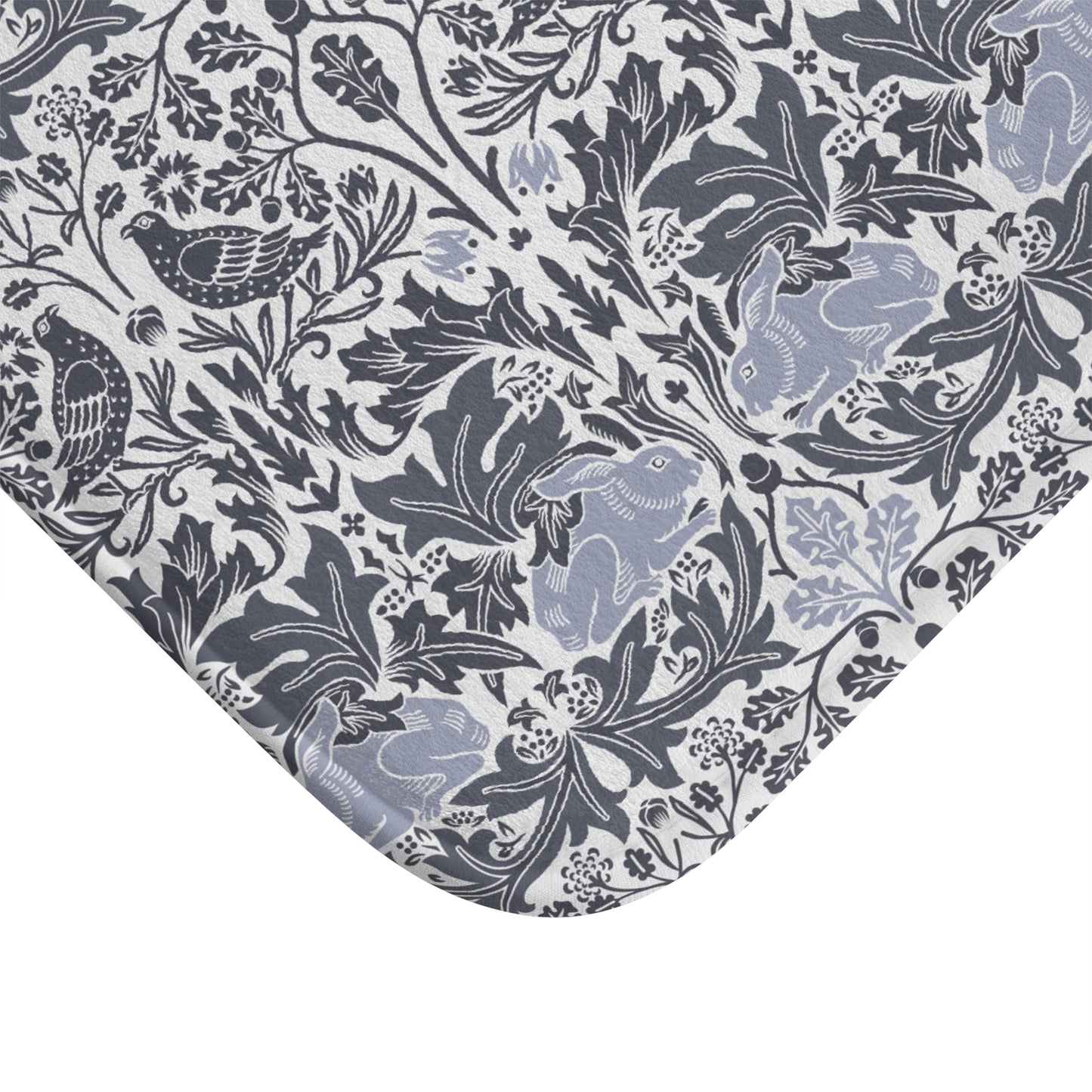 Microfibre bath mat with a gray and white floral pattern inspired by William Morris' work.