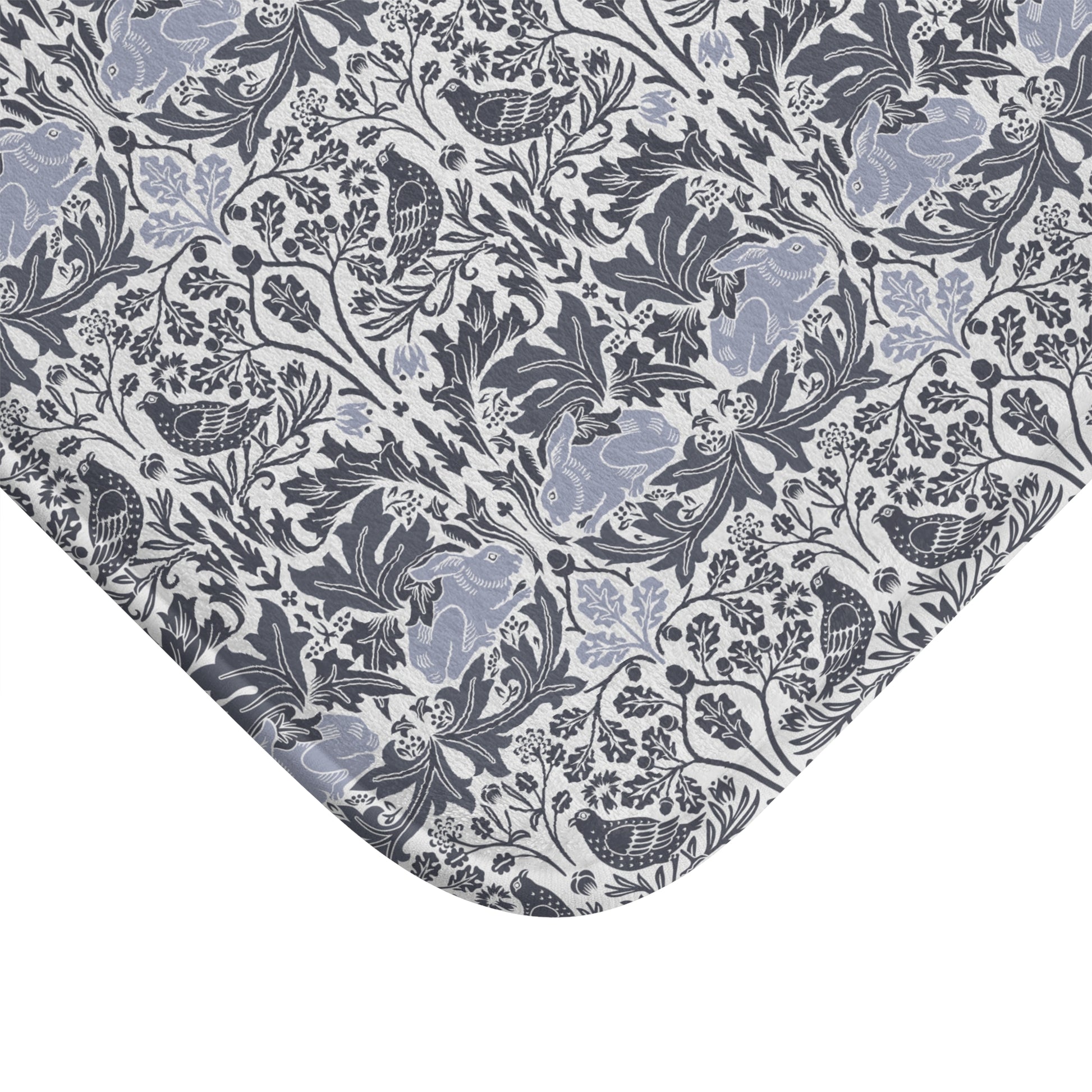 Microfibre bath mat with a gray and white floral pattern inspired by William Morris' work.