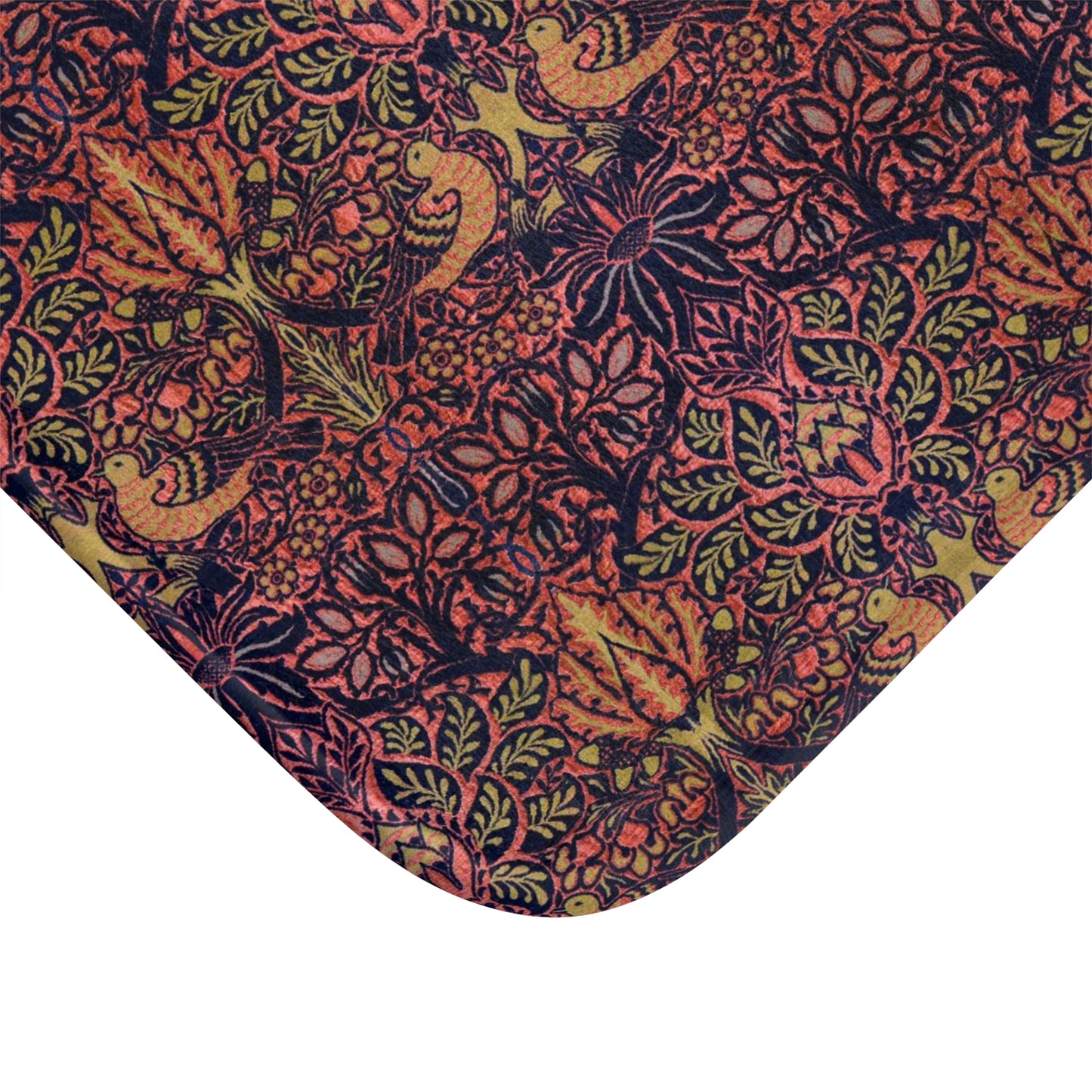 Close-up of a patterned fabric with birds and leaves on a white background