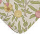 Fabric with a floral pattern featuring green leaves and pink flowers on a beige background