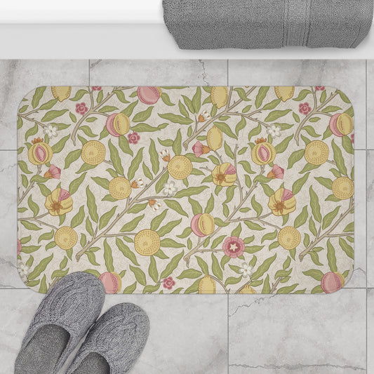 Floral patterned rug on a tiled floor with slippers and a towel.