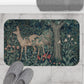 A microfibre bath mat featuring an intricate design of a deer in a forest setting, inspired by the William Morris tapestry.