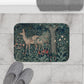 A microfibre bath mat featuring an intricate design of a deer in a forest setting, inspired by the William Morris tapestry.