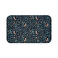 Patterned doormat with birds and flowers on a dark blue background