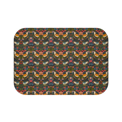 A rectangular microfibre bath mat with a colorful floral and bird pattern inspired by William Morris.