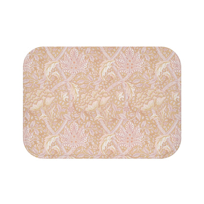 A rectangular microfibre bath mat with a floral pattern inspired by William Morris, in beige, pink and orange colours.