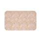 A rectangular microfibre bath mat with a floral pattern inspired by William Morris, in beige, pink and orange colours.
