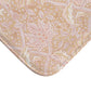 A rectangular microfibre bath mat with a floral pattern inspired by William Morris, in beige, pink and orange colours.