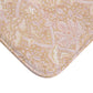 A rectangular microfibre bath mat with a floral pattern inspired by William Morris, in beige, pink and orange colours.