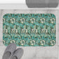 Microfibre bath mat with a floral pattern inspired by William Morris, predominantly in blue and white colours.