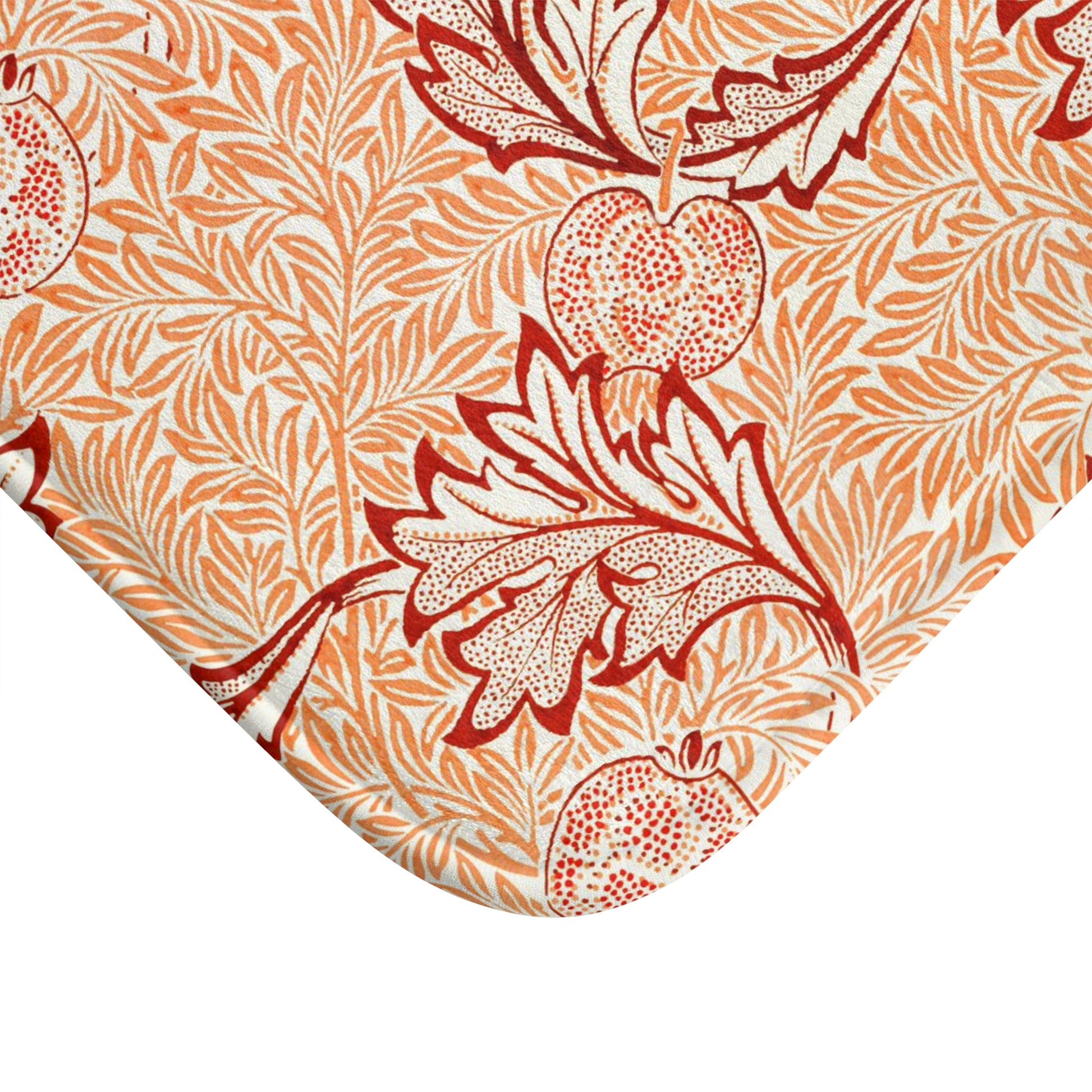 Rectangular microfibre bath mat with an orange and white floral pattern inspired by William Morris' Apple Collection.