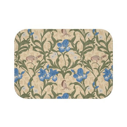Microfibre bath mat with a floral pattern inspired by William Morris, predominantly blue irises on a beige background.