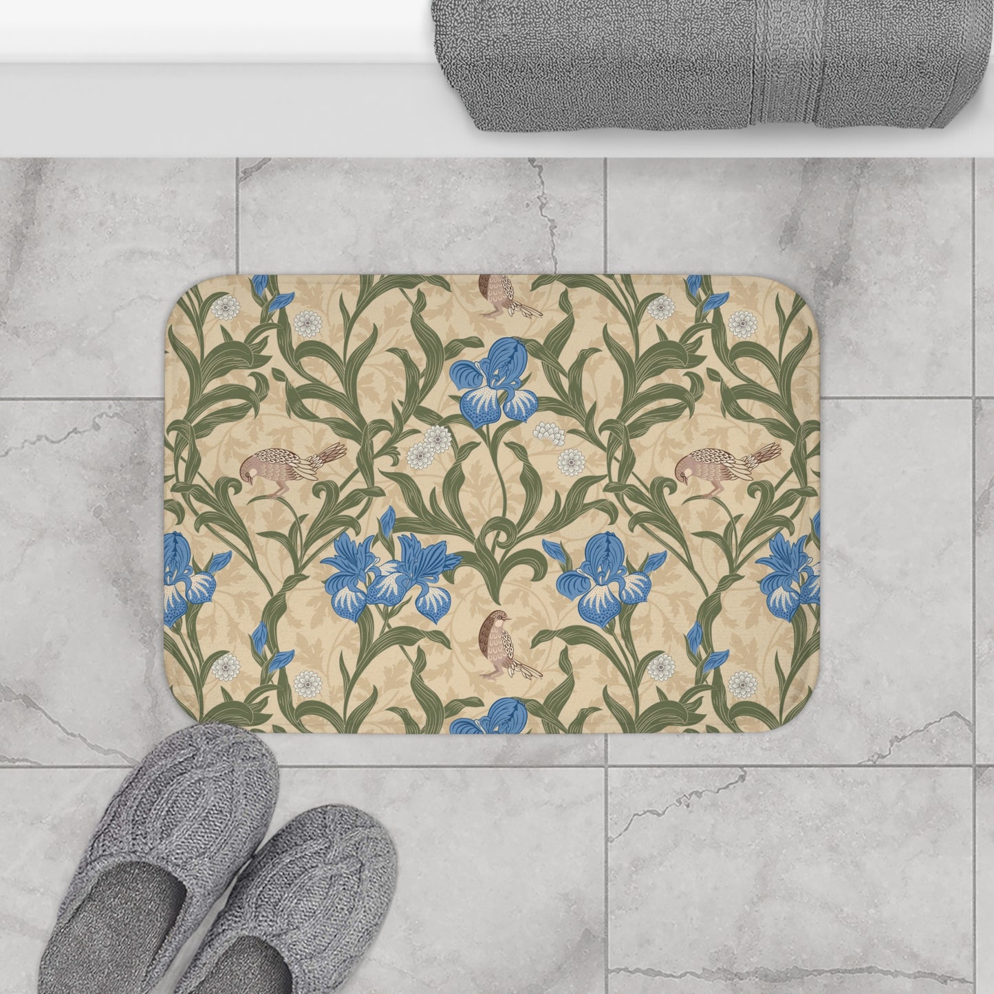 Microfibre bath mat with a floral pattern inspired by William Morris, predominantly blue irises on a beige background.