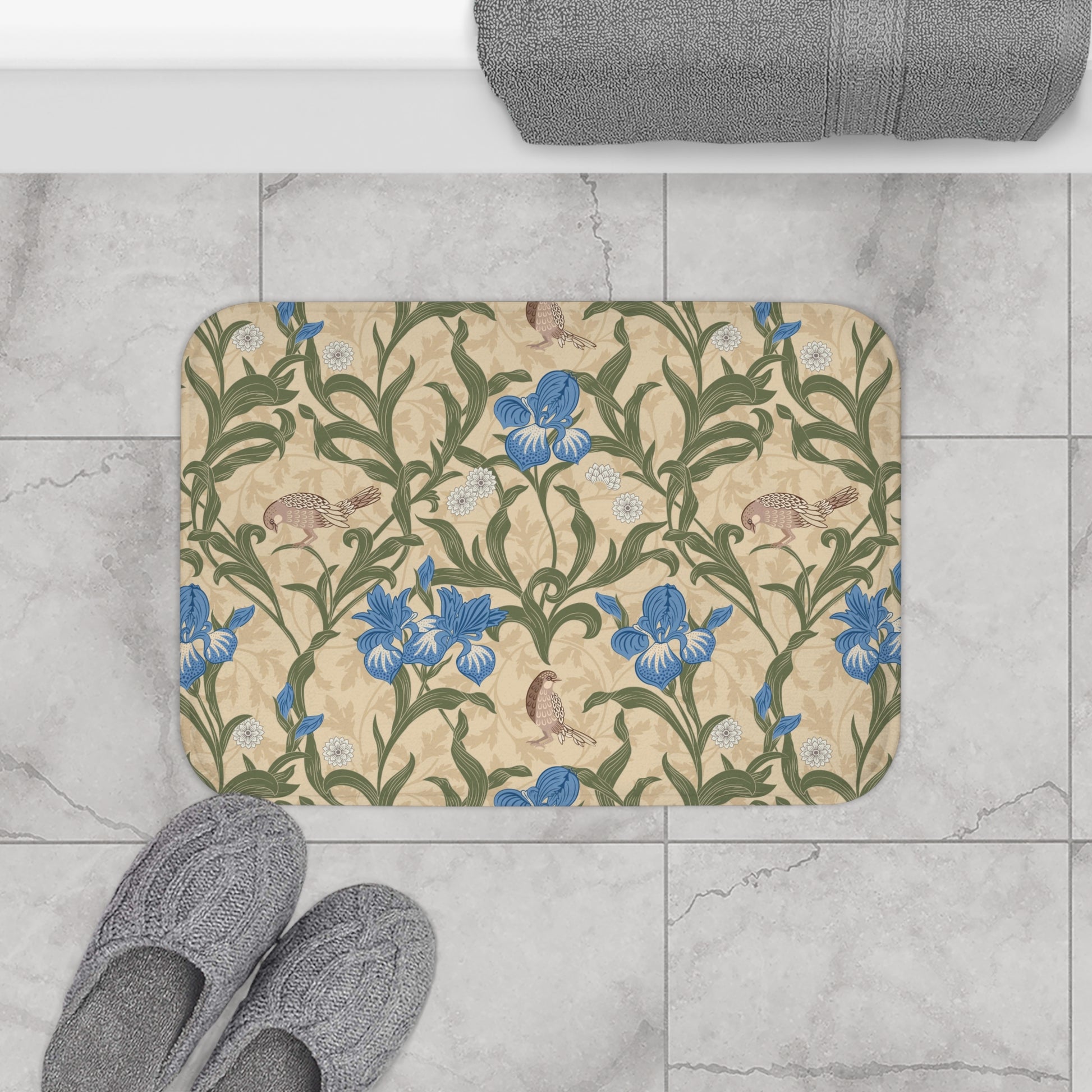 Microfibre bath mat with a floral pattern inspired by William Morris, predominantly blue irises on a beige background.