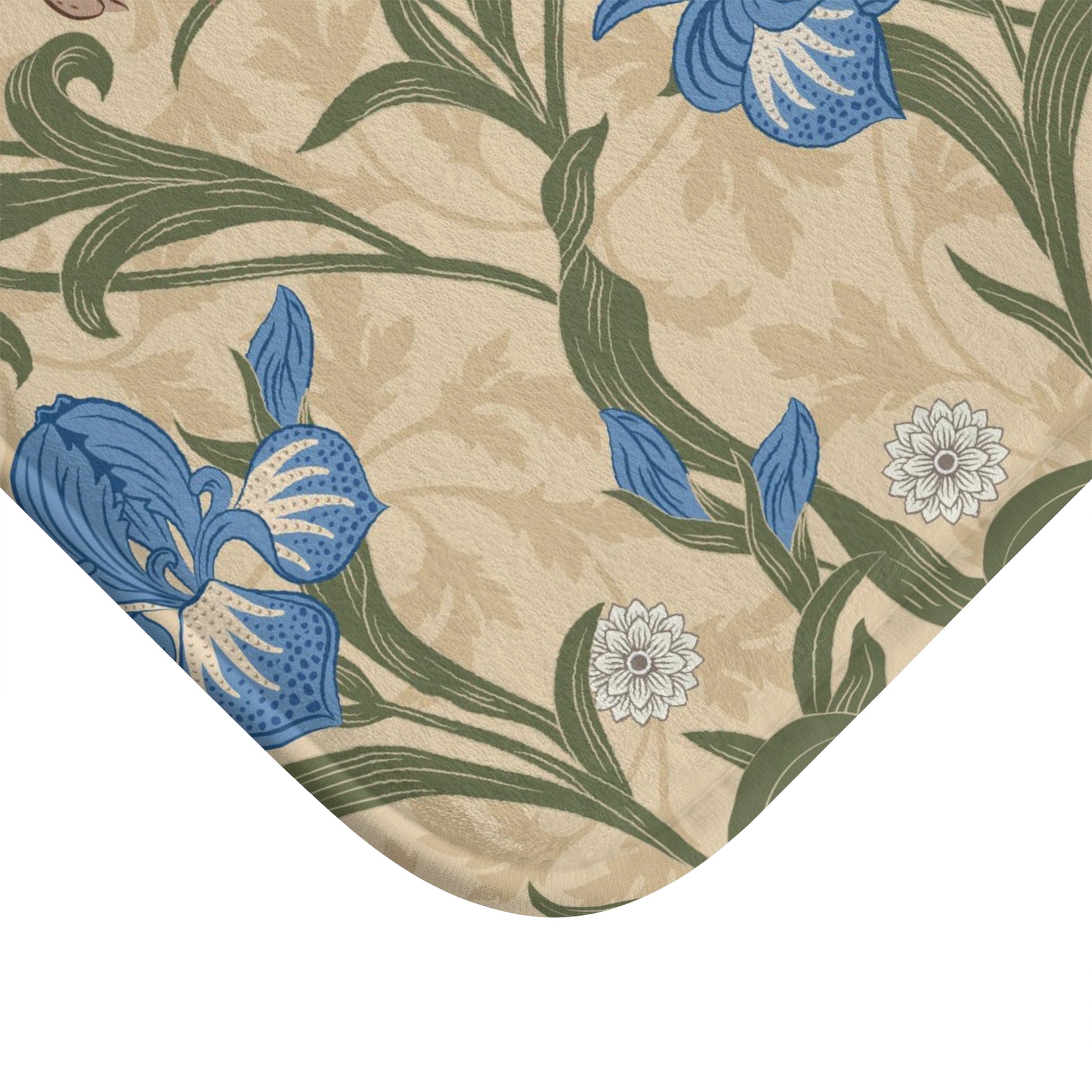 Microfibre bath mat with a floral pattern inspired by William Morris, predominantly blue irises on a beige background.