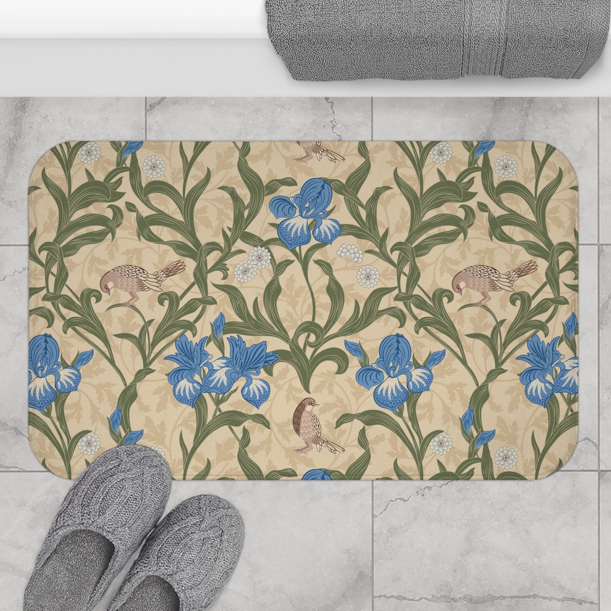 Microfibre bath mat with a floral pattern inspired by William Morris, predominantly blue irises on a beige background.