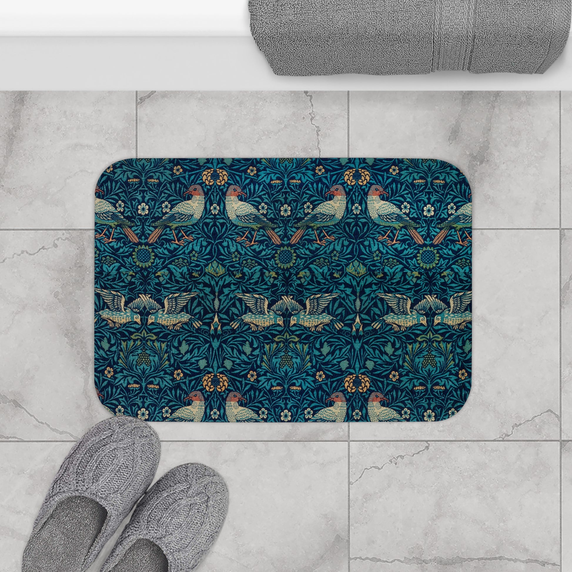 Microfibre bath mat with a blue colour and a pattern inspired by William Morris, featuring birds and floral designs.