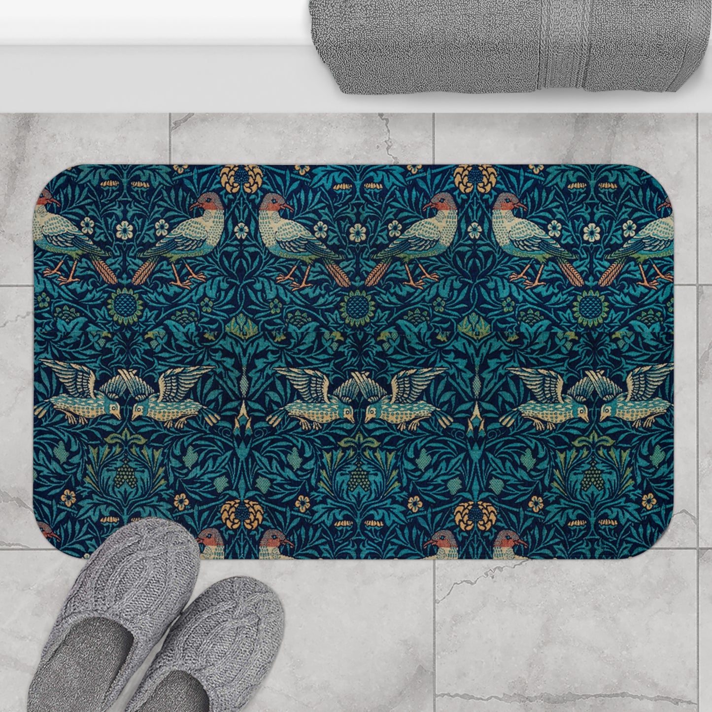 Microfibre bath mat with a blue colour and a pattern inspired by William Morris, featuring birds and floral designs.