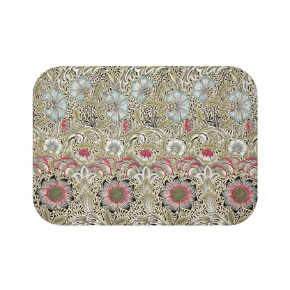 A rectangular microfibre bath mat with a floral pattern inspired by William Morris, predominantly in beige, green and pink colours.