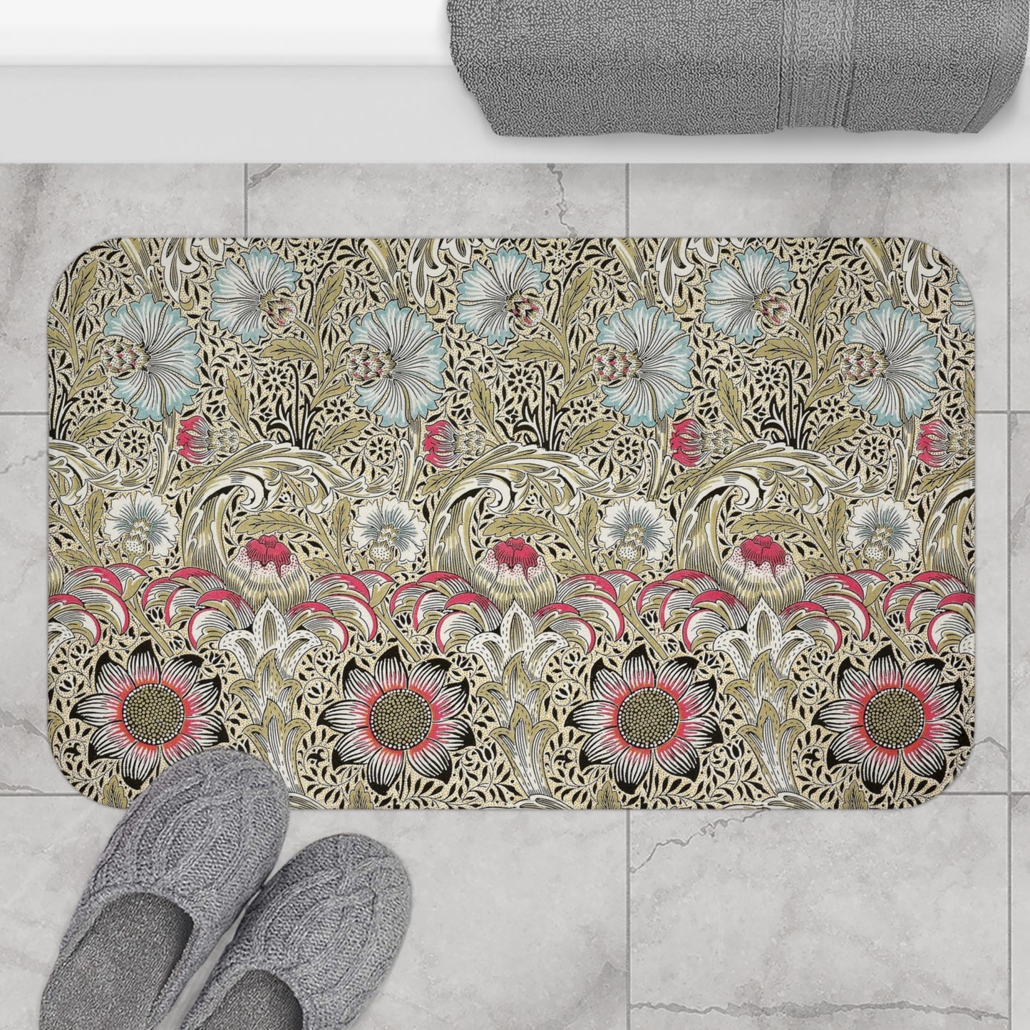 A rectangular microfibre bath mat with a floral pattern inspired by William Morris, predominantly in beige, green and pink colours.