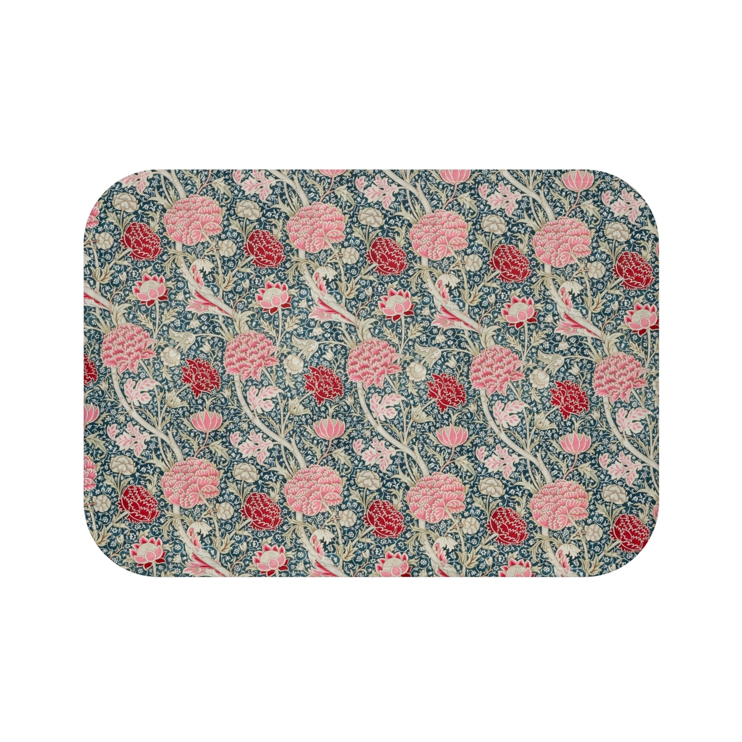 Microfibre bath mat with a floral pattern in shades of pink and green on a blue background, with a textured and non-slip appearance.