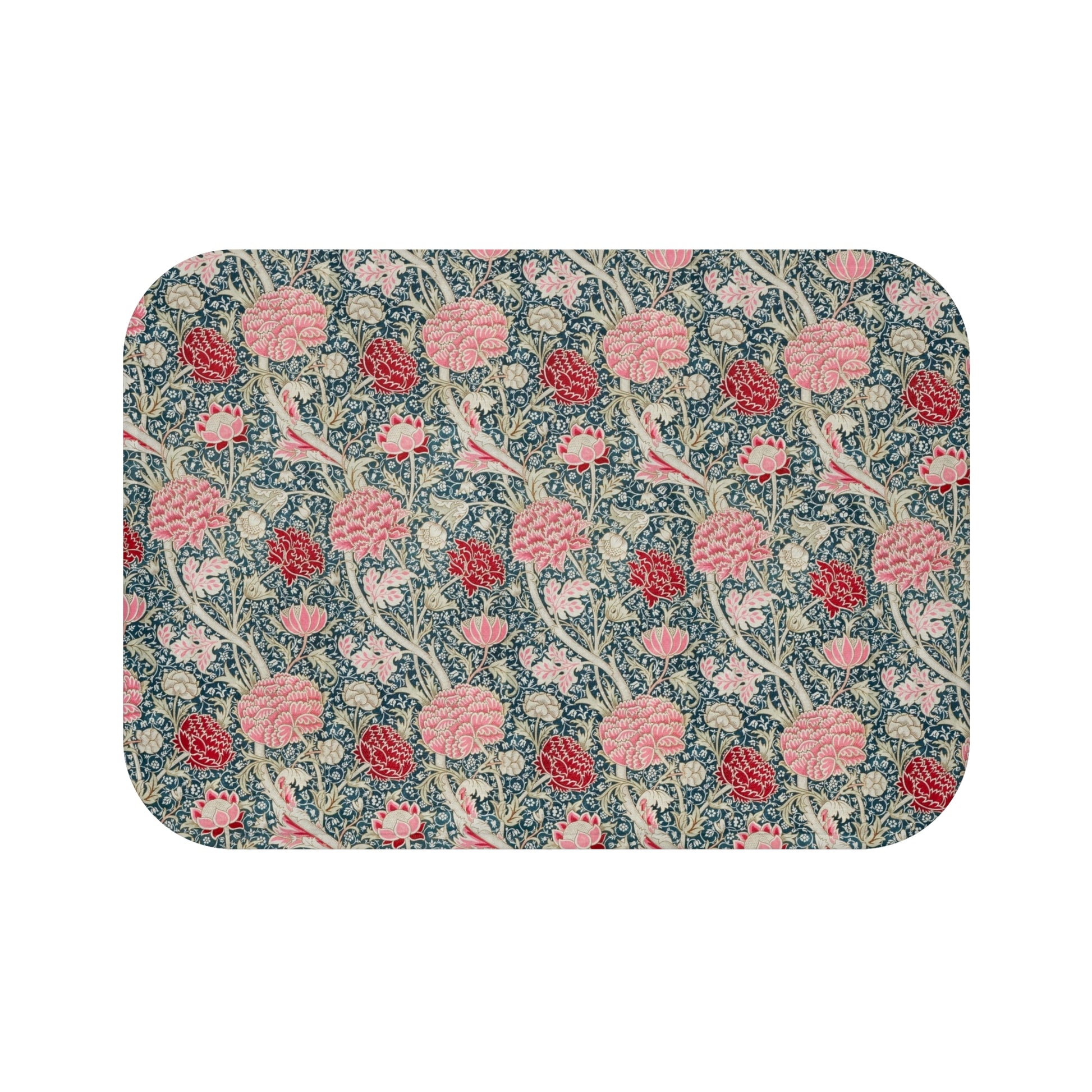 Microfibre bath mat with a floral pattern in shades of pink and green on a blue background, with a textured and non-slip appearance.