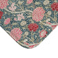 Floral patterned fabric with pink and red flowers on a blue background