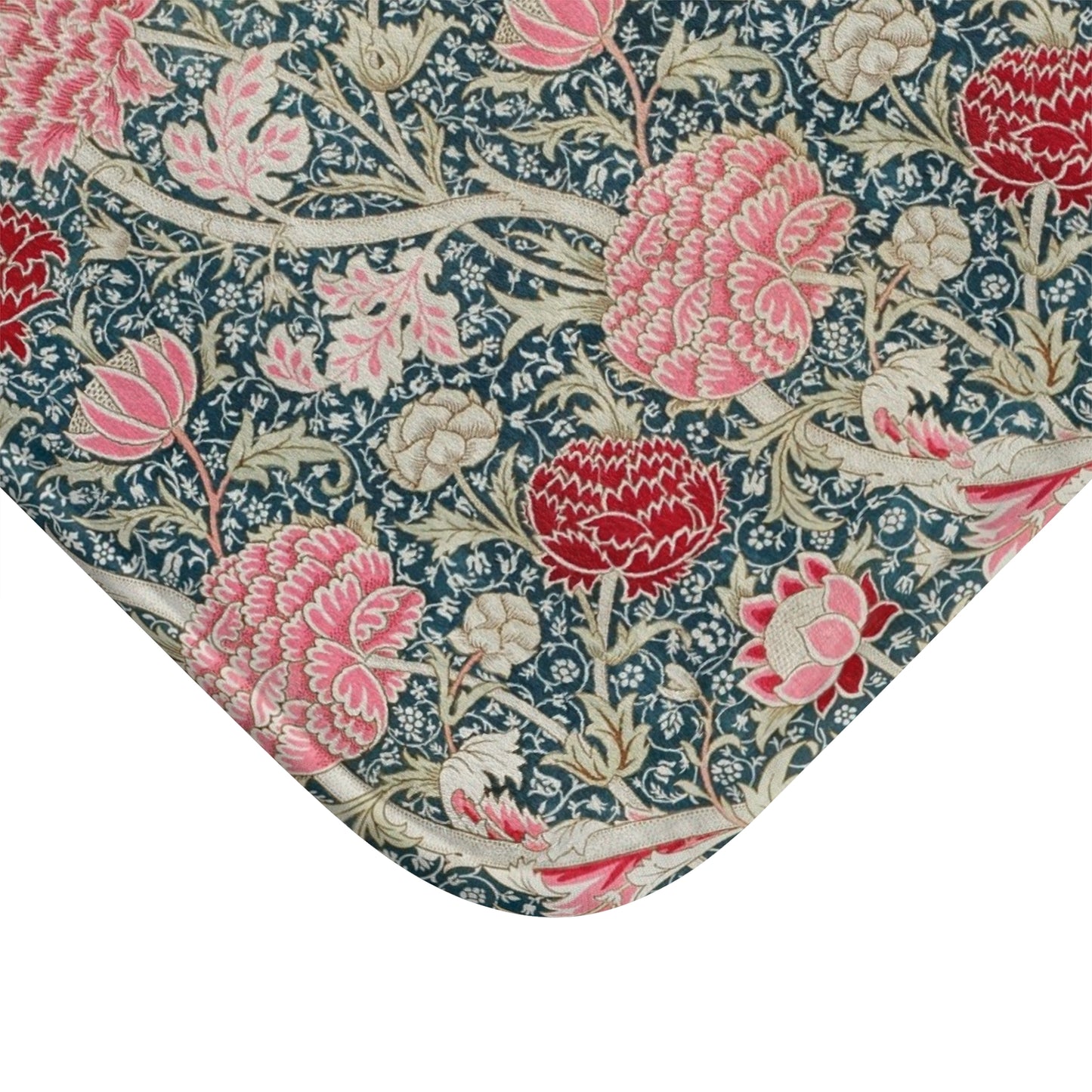 Floral patterned fabric with pink and red flowers on a blue background