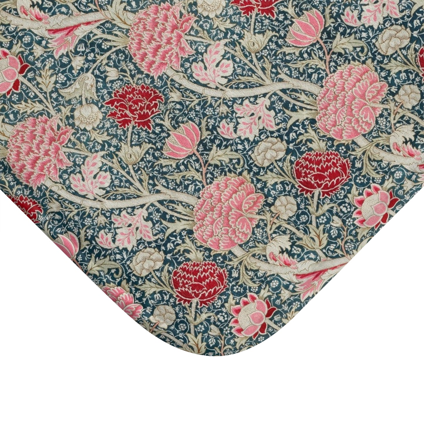 Floral patterned fabric with pink and red flowers on a blue background