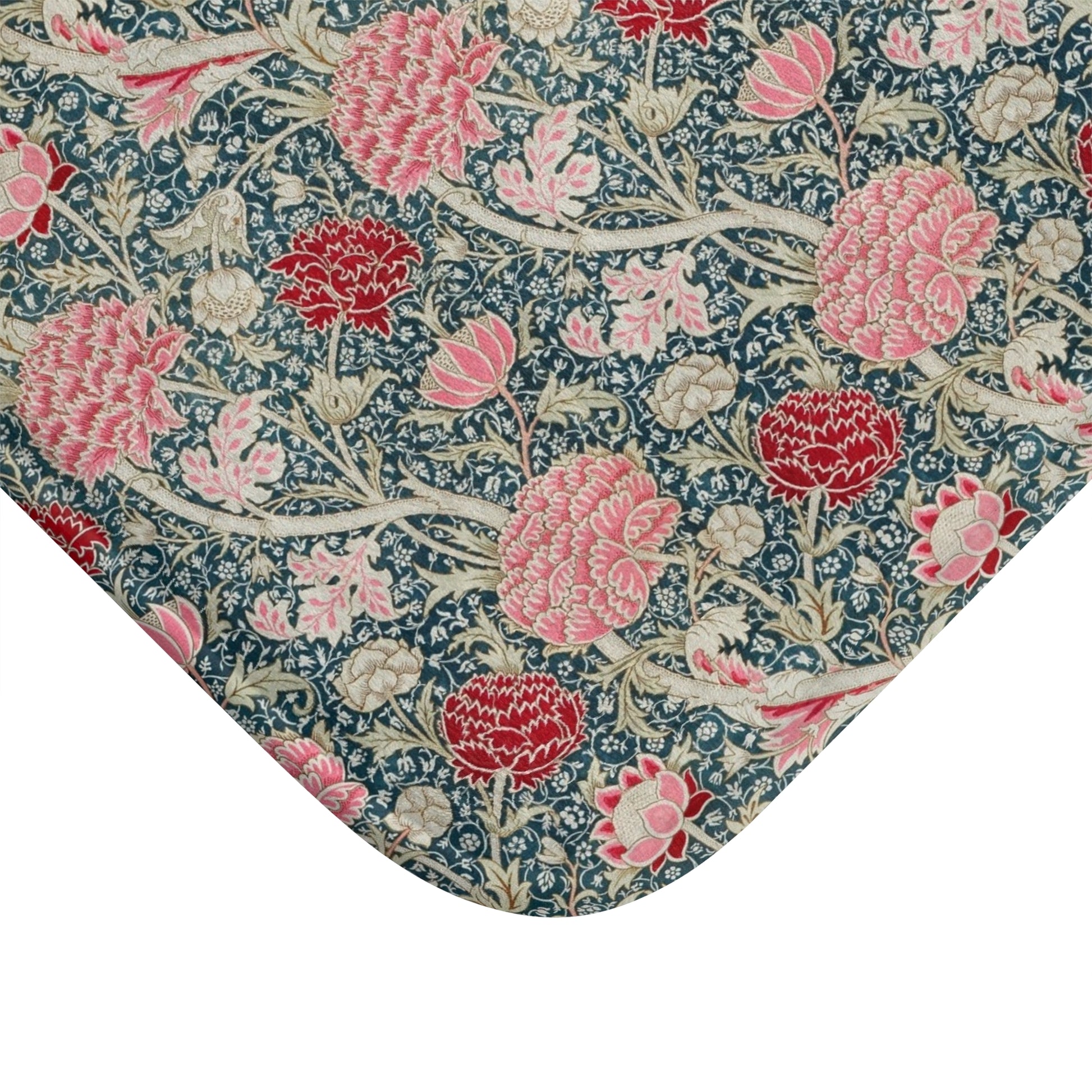 Floral patterned fabric with pink and red flowers on a blue background