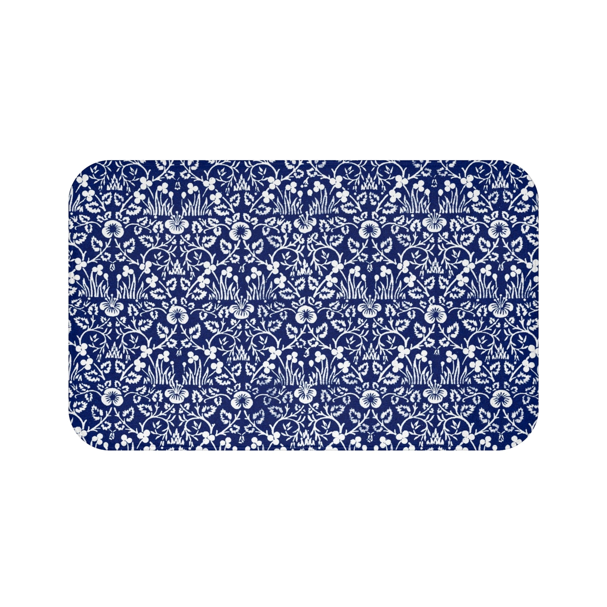 A rectangular microfibre bath mat with a blue floral pattern inspired by William Morris.