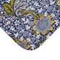 Close-up of a floral patterned fabric with blue, yellow, and white colors.