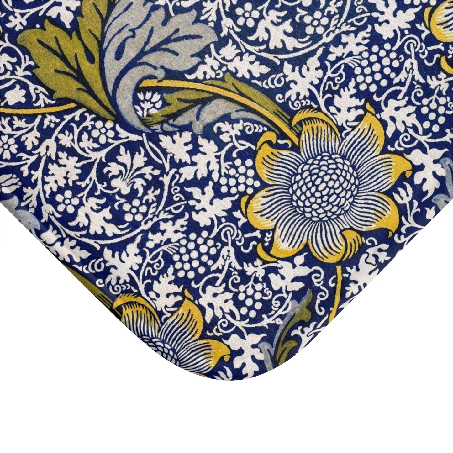 Close-up of a floral patterned fabric with blue, yellow, and white colors.