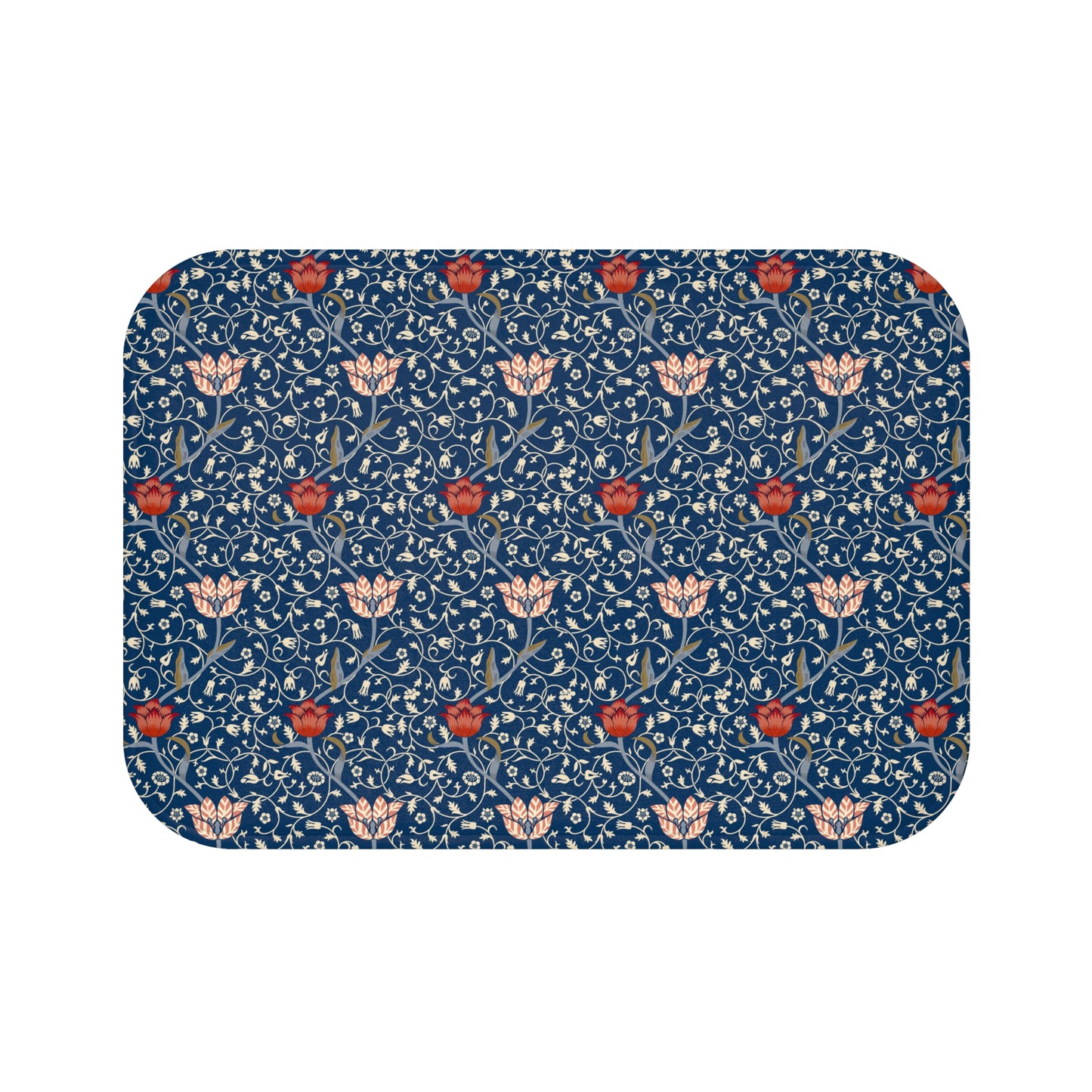 A rectangular microfibre bath mat with a floral pattern inspired by William Morris, predominantly blue with red and white accents.