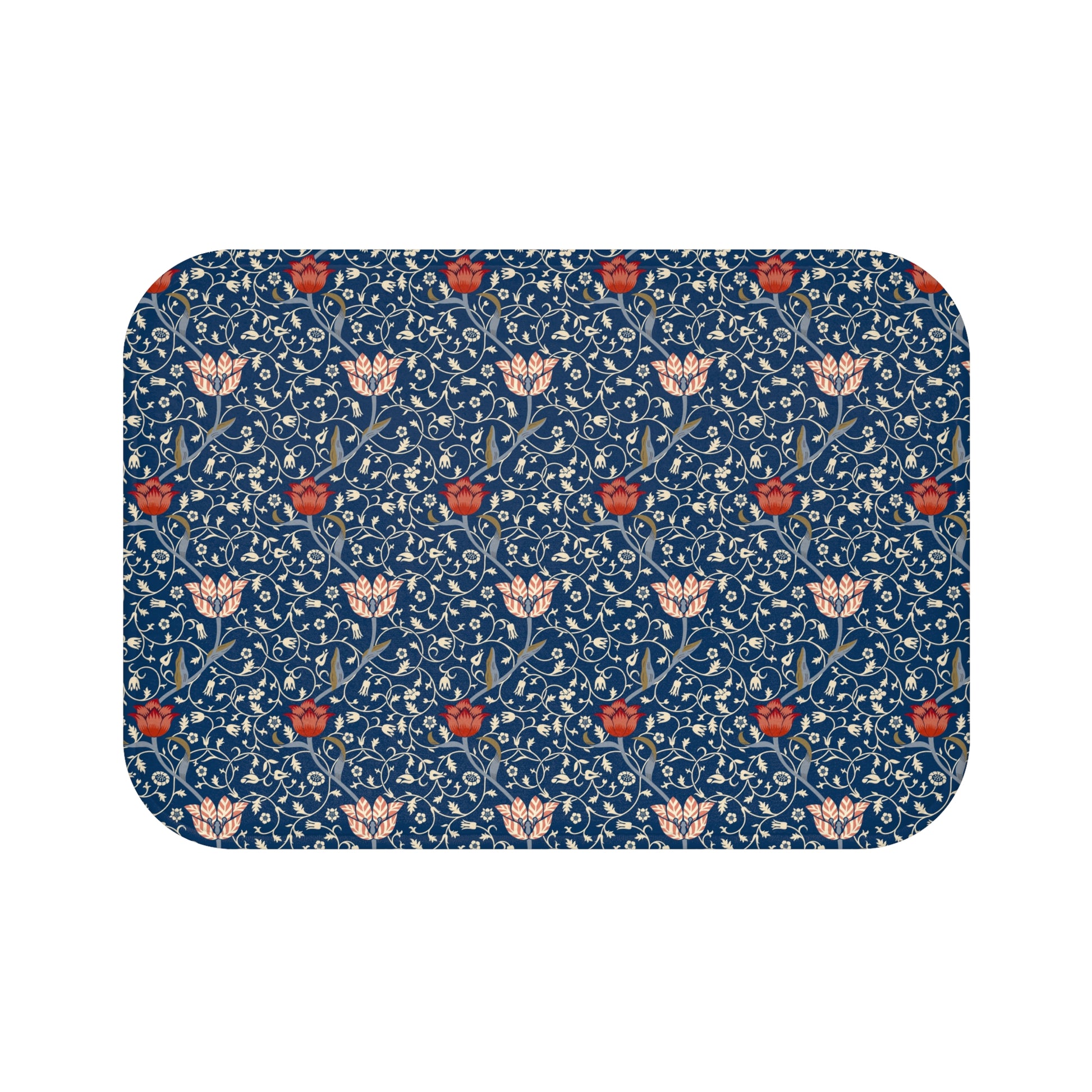 A rectangular microfibre bath mat with a floral pattern inspired by William Morris, predominantly blue with red and white accents.