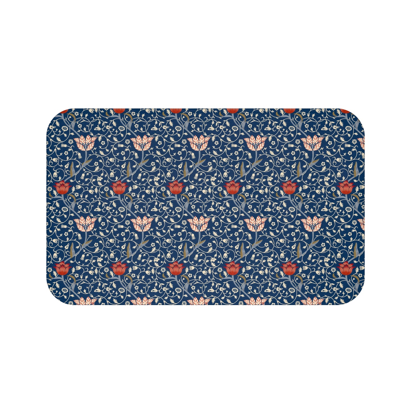 A rectangular microfibre bath mat with a floral pattern inspired by William Morris, predominantly blue with red and white accents.