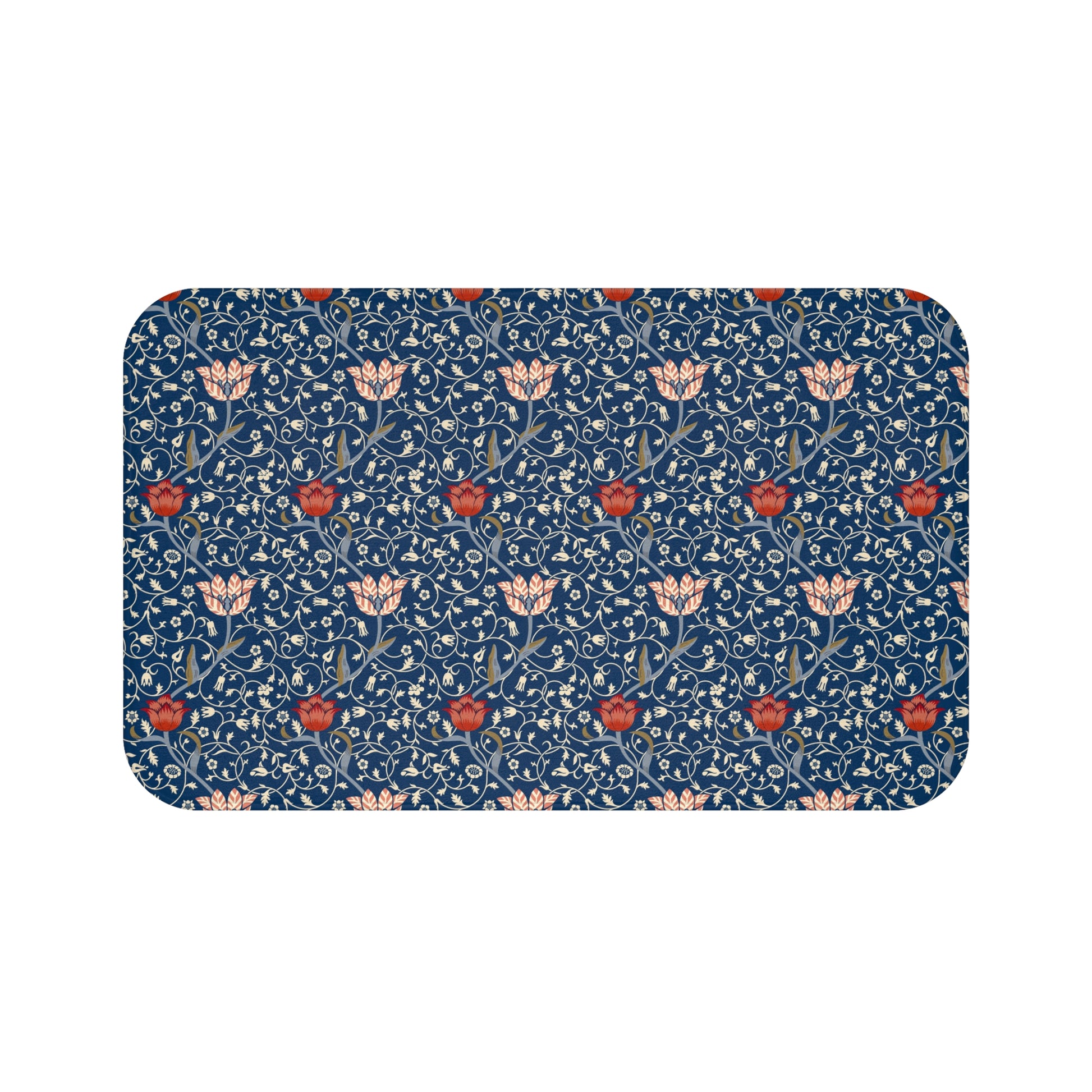 A rectangular microfibre bath mat with a floral pattern inspired by William Morris, predominantly blue with red and white accents.