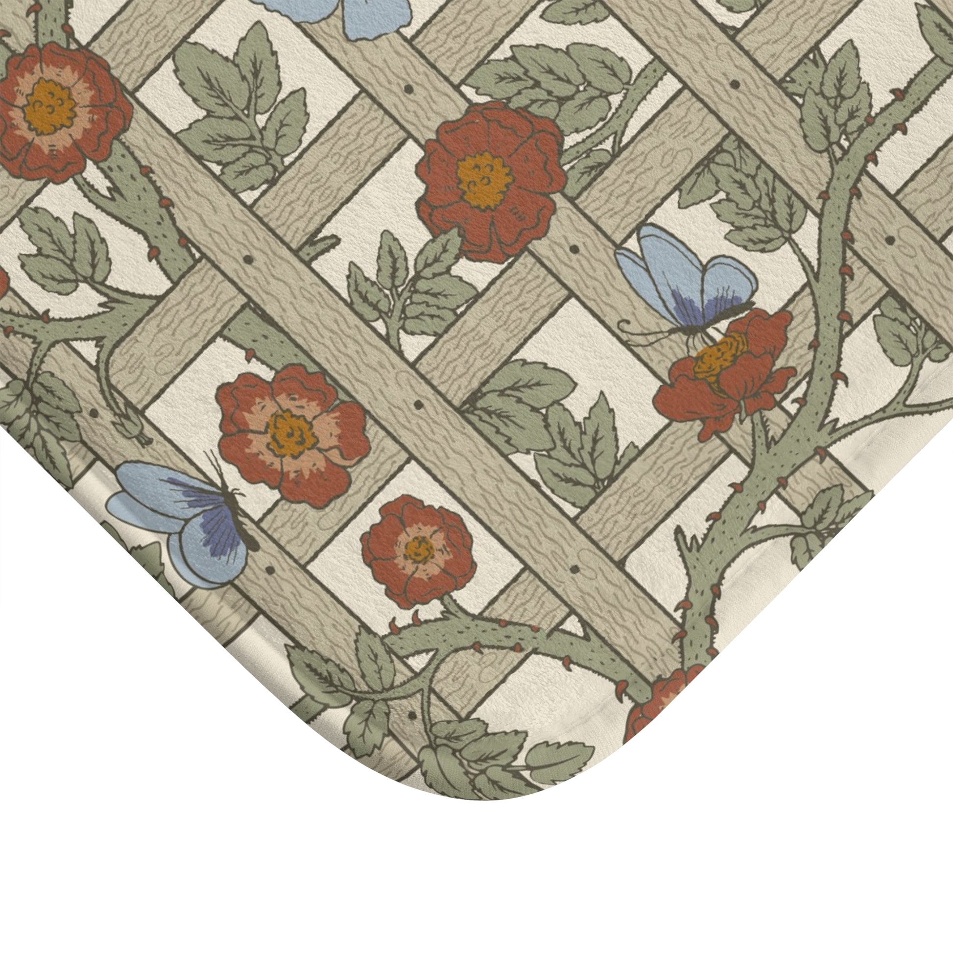 A microfibre bath mat with a floral pattern inspired by William Morris, featuring a grid of flowers and leaves.