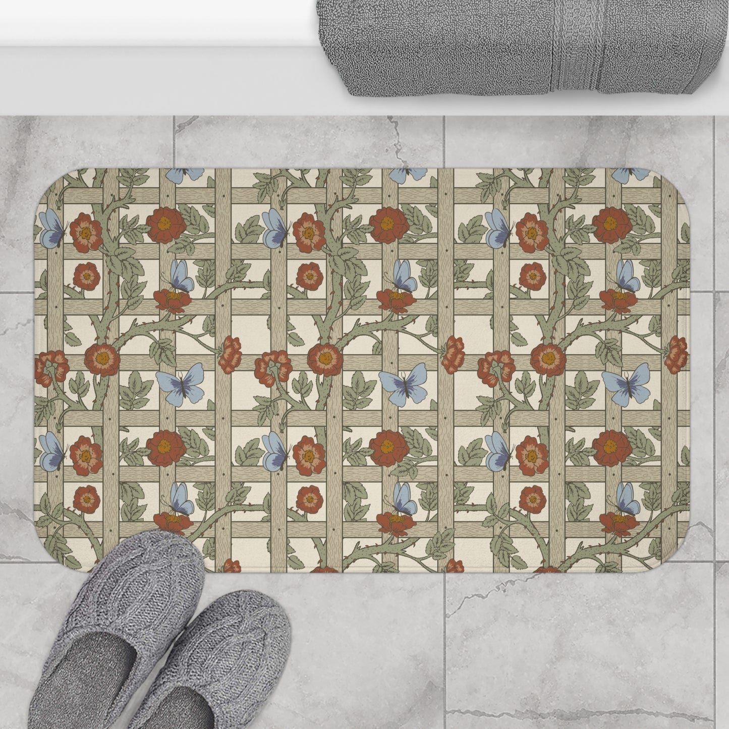 A microfibre bath mat with a floral pattern inspired by William Morris, featuring a grid of flowers and leaves.
