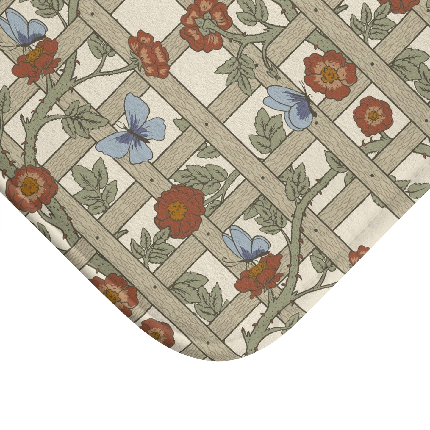 A microfibre bath mat with a floral pattern inspired by William Morris, featuring a grid of flowers and leaves.