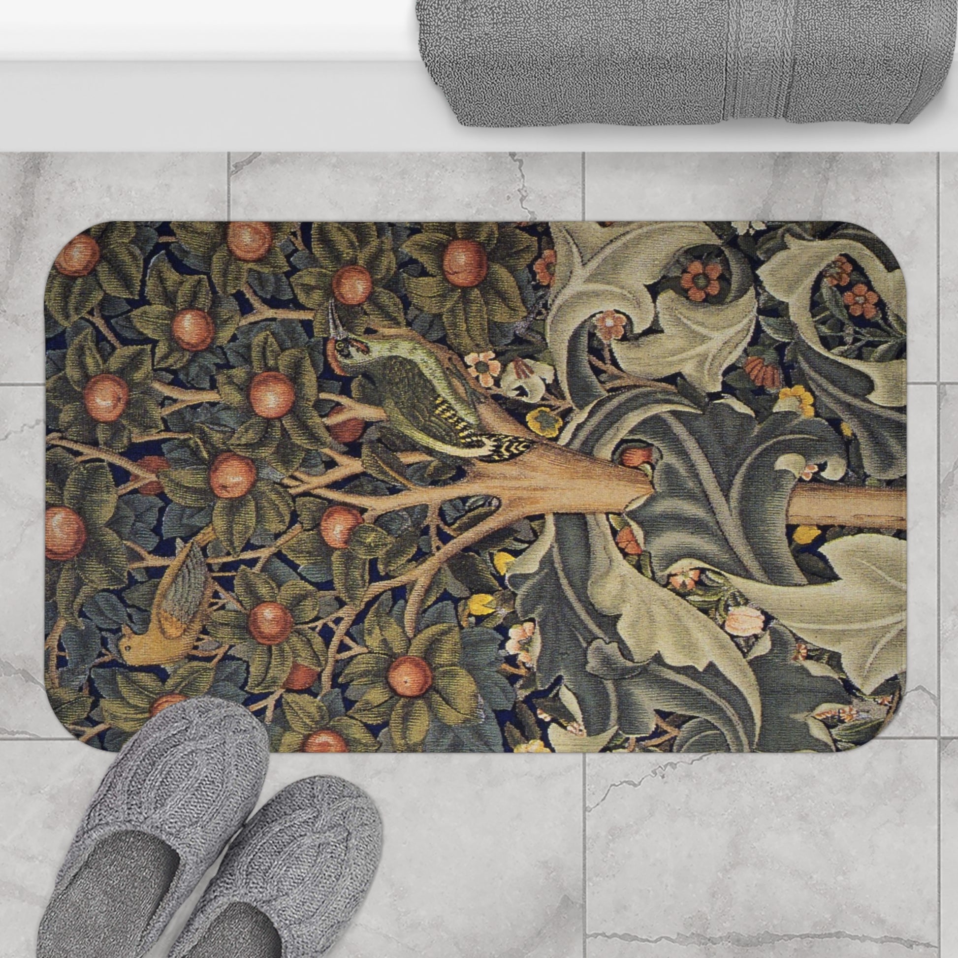 Decorative doormat with nature-themed design on a tiled floor with slippers.