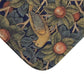 Close-up of a patterned fabric with leaves and fruits on a white background