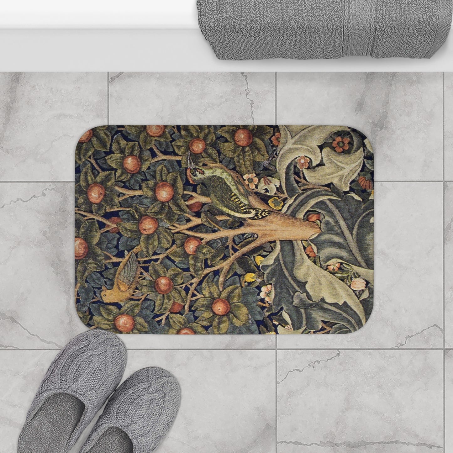 Decorative doormat with nature-themed design on a tiled floor with slippers.